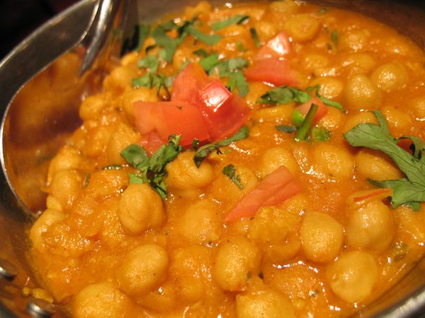 Chana masala chickpea curry with fresh tomato and coriander